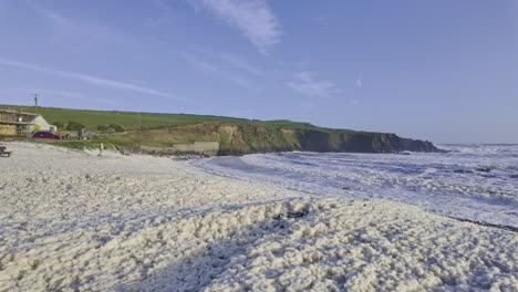 sea foam blowing up beach at kilmurrin in storm kathleen on the copper coast waterford ireland natures wonders