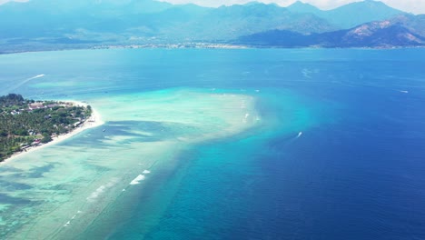 indonesia,tropical islands, mountain range and perfectly clear seawater, aerial seascape