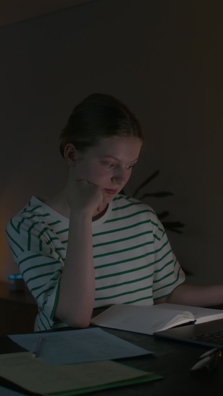 Teenager Studying Late at Night