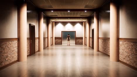 a modern hallway corridor with elegant lighting, smooth tiled flooring , walls with stone, wooden trims and doors, and a woman idle infront of an elevator at the far end