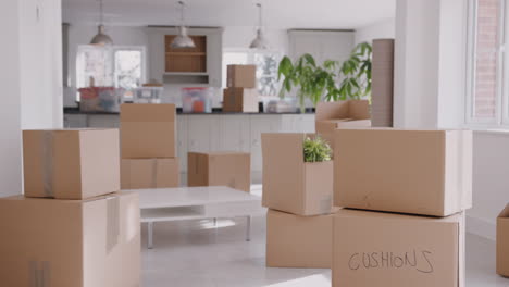 pull focus shot of removal boxes inside empty room on moving day