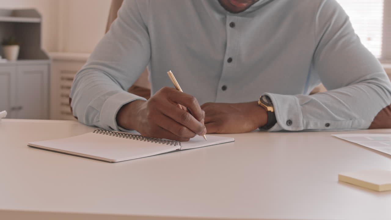 Cropped Man Writing in Notebook Arc