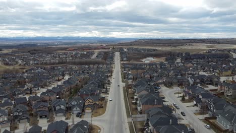 Aerial-view-of-a-modern-suburban-community-in-Calgary,-Canada,-in-spring-after-the-snow-melt