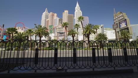 pedestrian guard rails move in the foreground of the new york new york location on the las vegas strip. the streets remain empty.