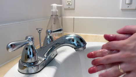 washing hands with soap and water