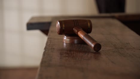 old wooden gavel on historic mid 1800s judges bench