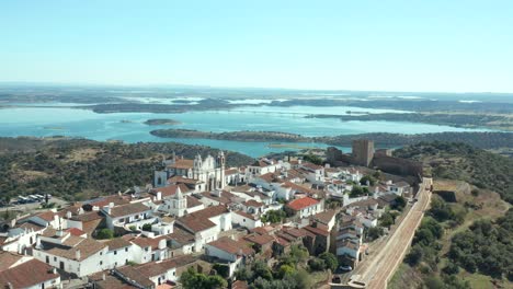 scenic view of monsaraz castle with alqueva lake background, portugal