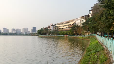 Lakeside-promenade,-serenity-of-the-moments-day-transitions-into-night