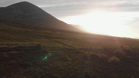 Aerial:-Sunshine-on-Croagh-Patrick-mountain-above-irish-landscape