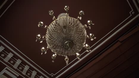 luxury old chandelier in an old mansion with camera movement 2