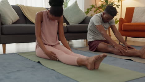 couple doing yoga at home