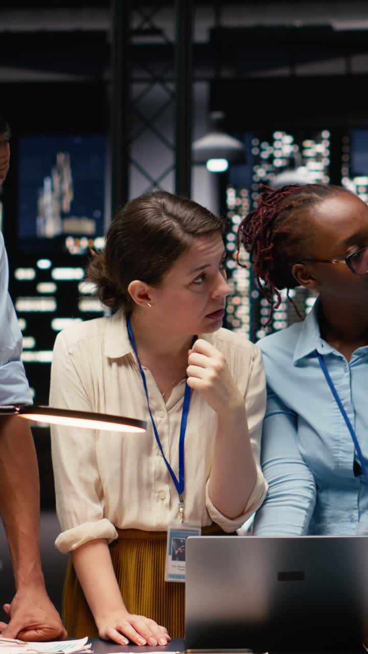 Vertical Video Multiethnic business team engaged in collaborative teamwork inside office