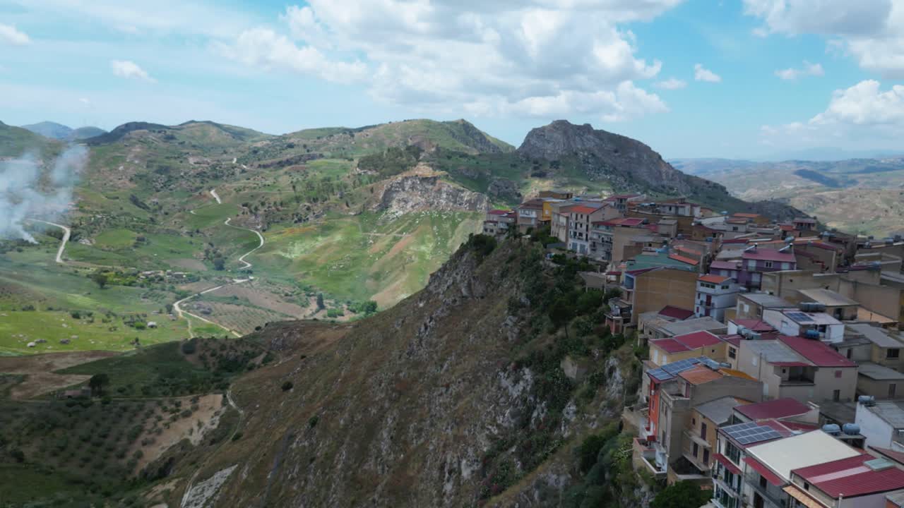 Aerial drone footage of Sant’Angelo Muxaro, Sicily: hilltop village surrounded by valleys and nature, rich in ancient history and rural charm. Perfect for travel, culture, and documentary projects