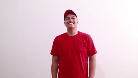 young handsome asian man in red standing while laughing