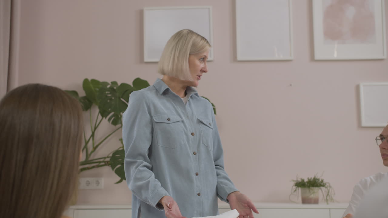 Blonde teacher talking in class