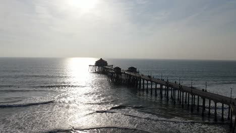 Aerial-view-of-Huntington-Beach-Pier-at-sunset,-California