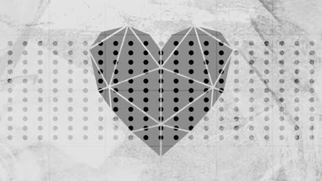 faceted heart against textured grey background