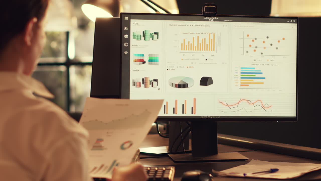 Startup employee analyzing company diagrams on computer
