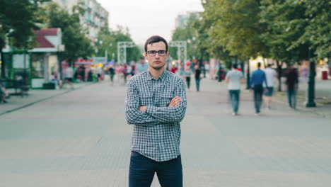 man standing on a city street