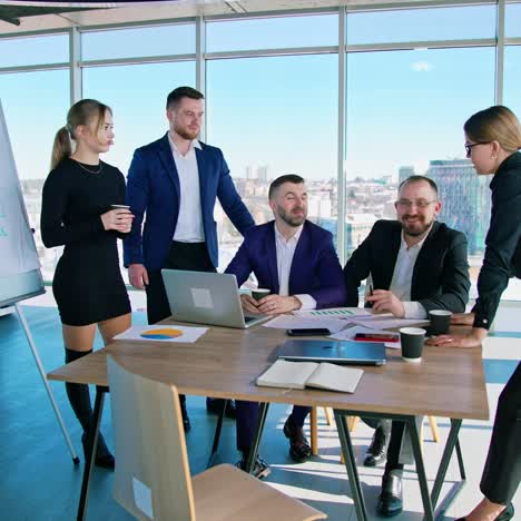 business meeting in modern office. group of diverse colleagues in formal clothing discussing business ideas