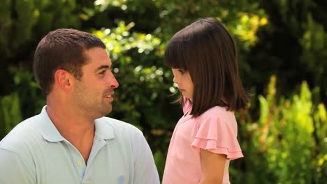 Father-talking-to-his-little-daughter