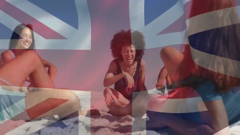 Animation-of-diverse-friends-at-beach-over-flag-of-great-britain