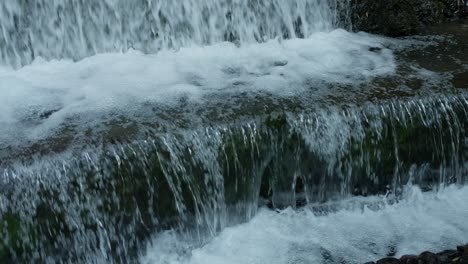 powerful water cascading down a big waterfall stair in barranca del cupatitzio, uruapan national park.