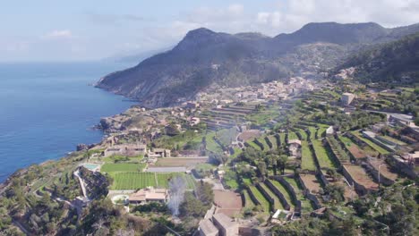 wide shot of banyalbufar in serra de tramuntana during day time, aerial