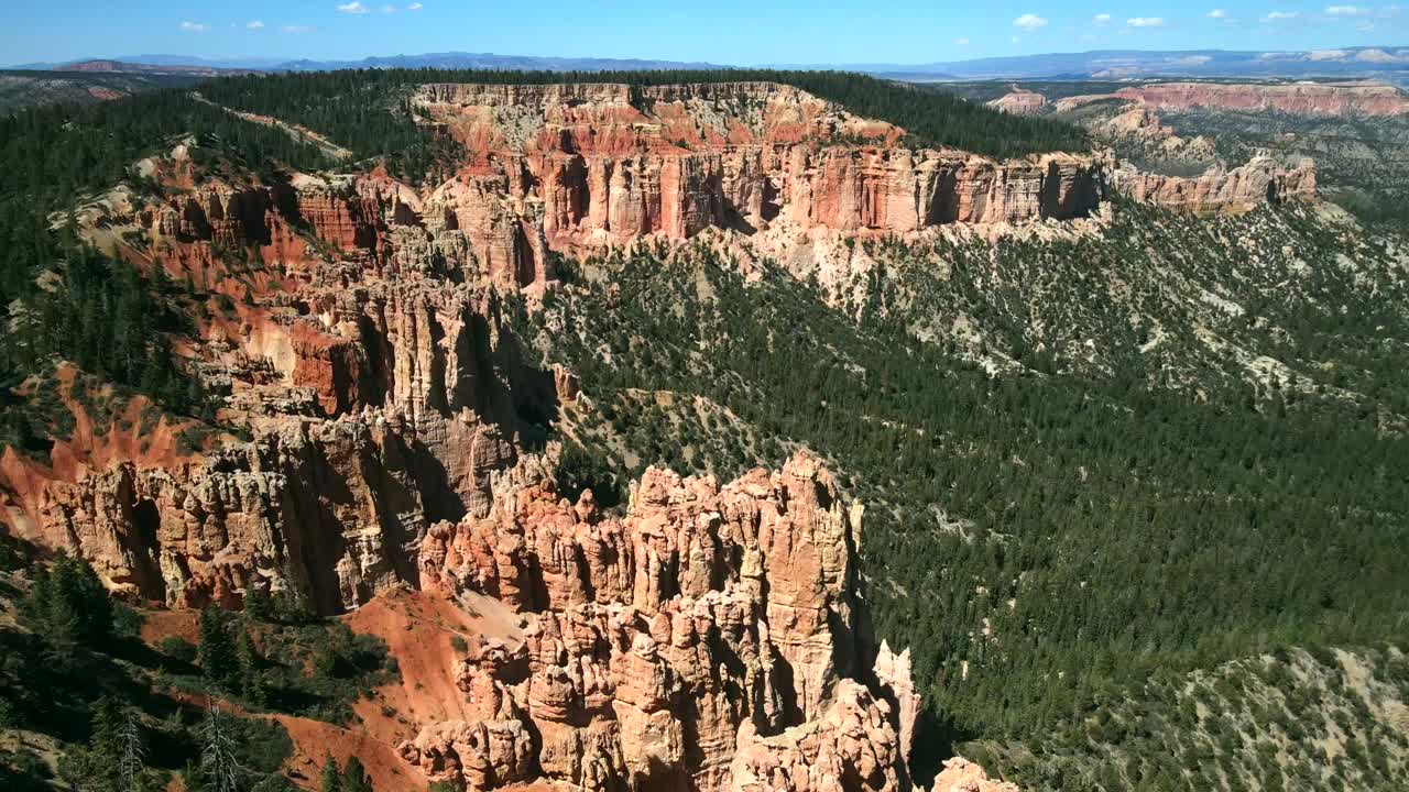 Aerial cinematography captured by a drone showcases the stunning red rock formations of Bryce Canyon's landscape