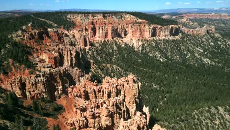 aerial cinematography captured by a drone showcases the stunning red rock formations of bryce canyon's landscape