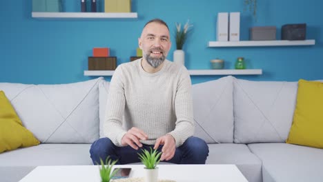 Happy-man-looking-at-camera-and-dancing.