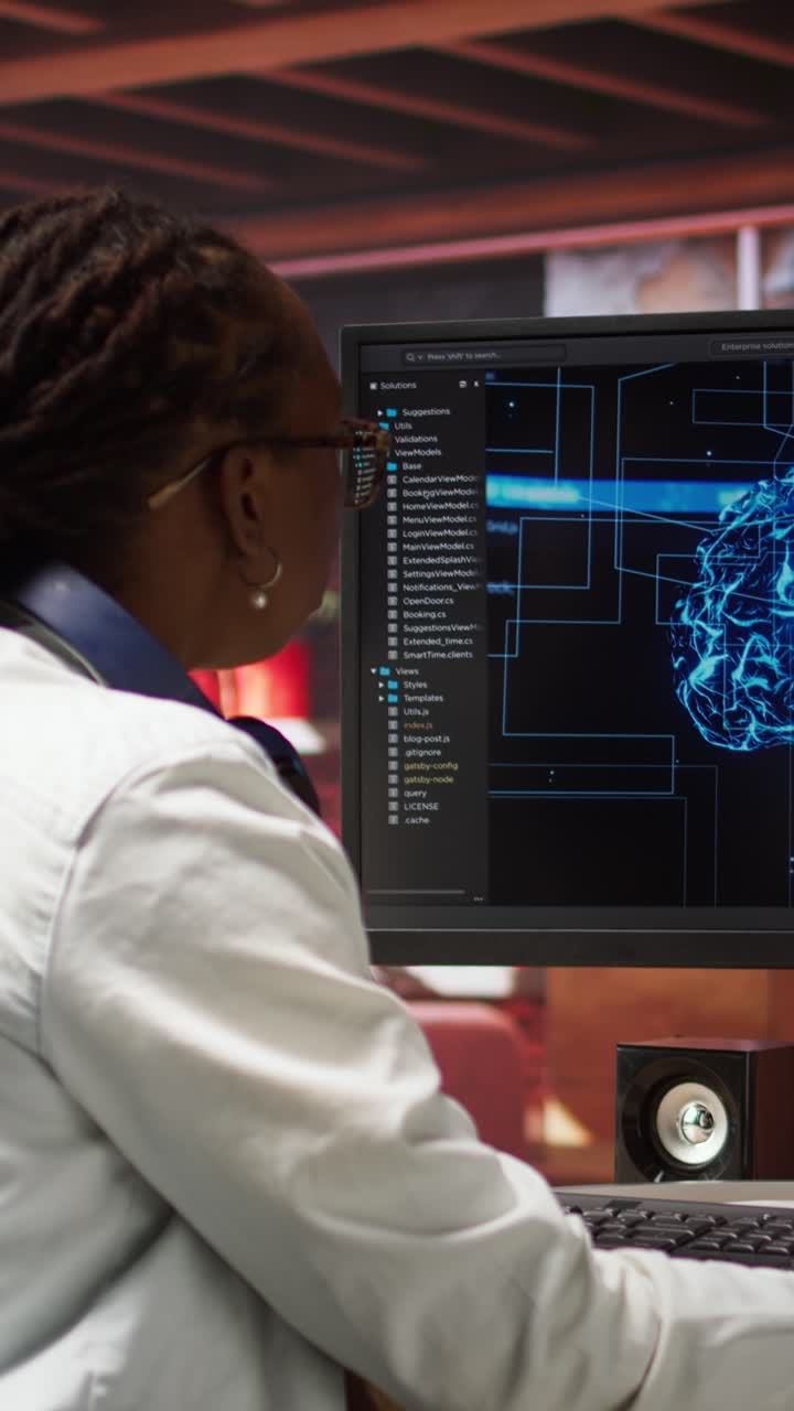 Vertical video Computer engineer doing checkup on artificial intelligence systems