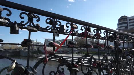 love locks on a bridge in a city