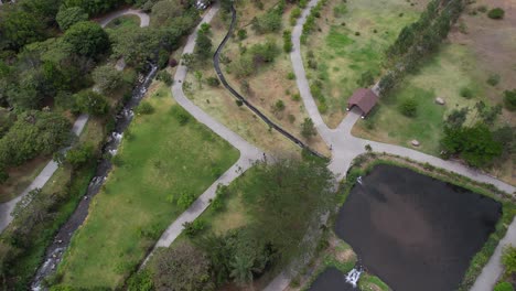 drone shot of lake in biblioteca park by caldera river, boquete, panama