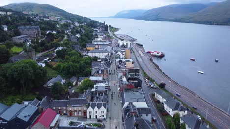 pedestrian street in fort william town, west highland museum, town centre - aerial drone 4k hd footage