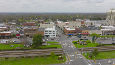 pull back from train tracks and main street in downtown thomasville, north carolina on a spring day