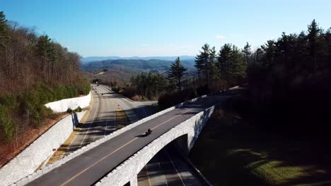 motorcycle aerial over the blue ridge parkway bridge near deep gap nc, near boone and blowing rock nc, north carolina over highway 421