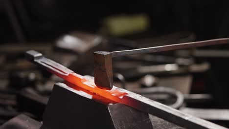 blacksmith working on red-hot metal