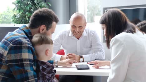 a large family takes a mortgage from a bank, buying a home on credit. the concept of lending, bank