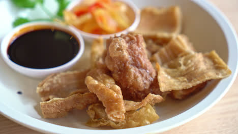 deep fried pork intestines with sweet black sauce - asian food style