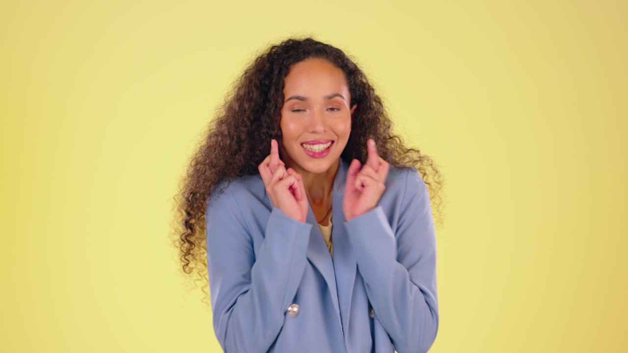 Fingers crossed, hope and black woman with hands