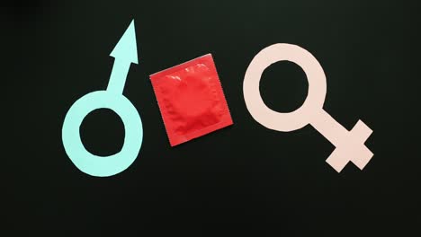 condom and gender symbols for safe sex and sexual health awareness