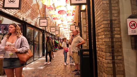 people walking through camden market in london