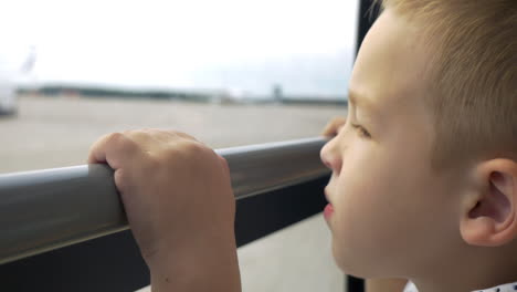 child having a bus ride on airport area