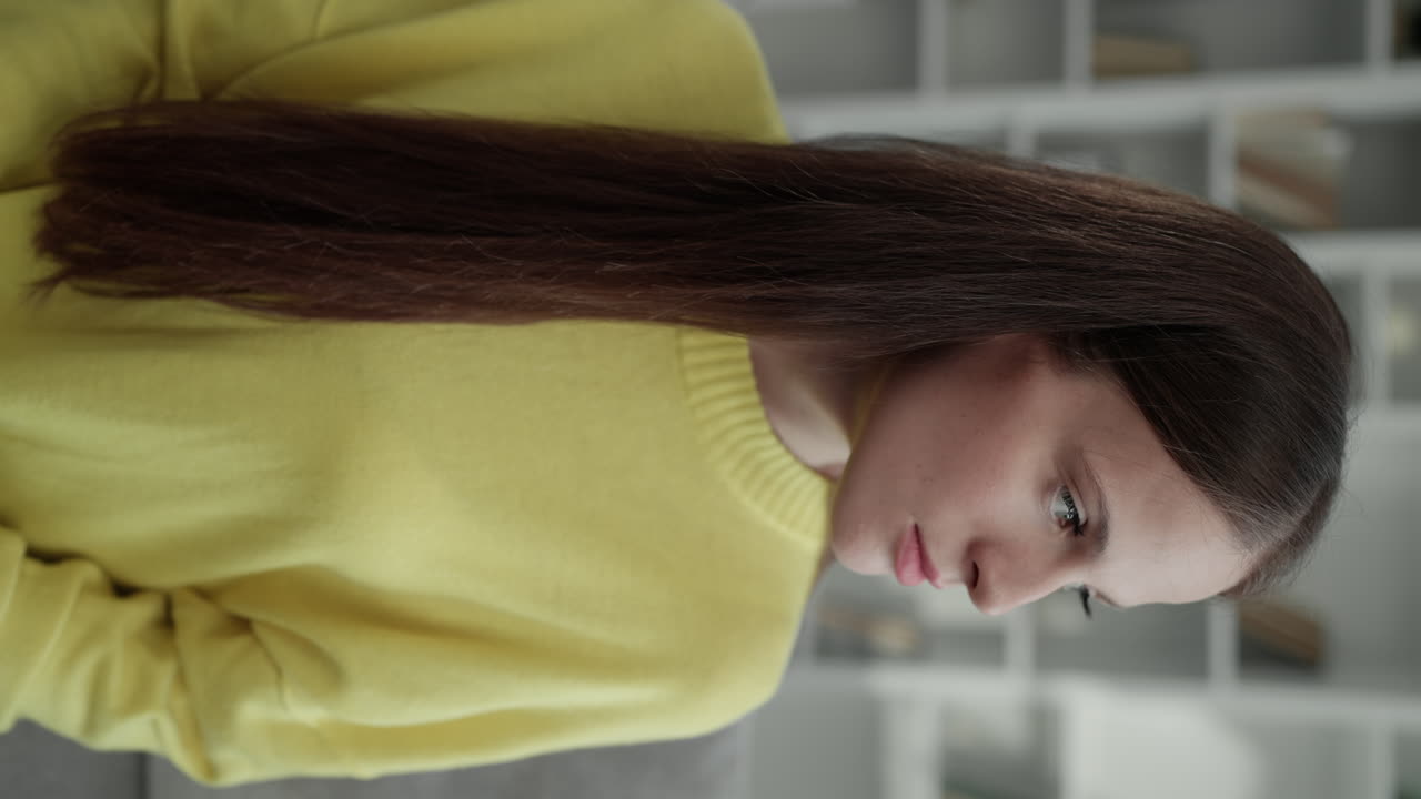 Portrait of a woman in a yellow sweater