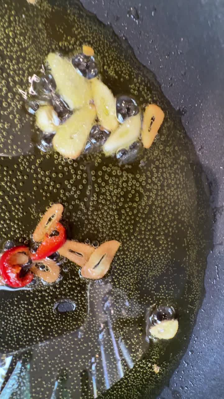 Cooking garlic and red peppers in a pan