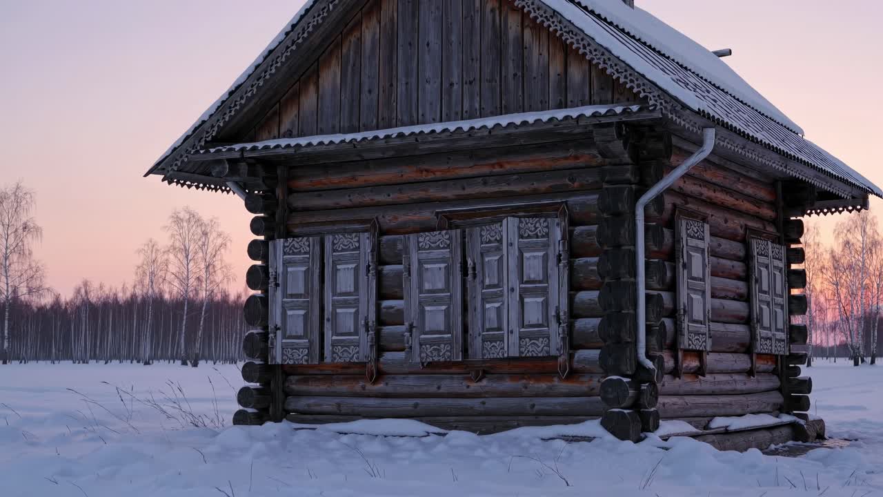 Hirsimökki talvisessa maisemassa