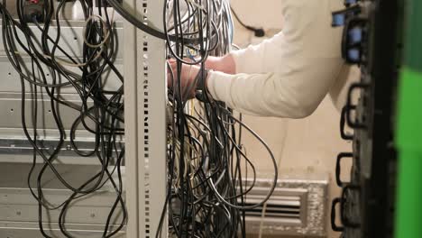 technician configures the network equipment in the server room