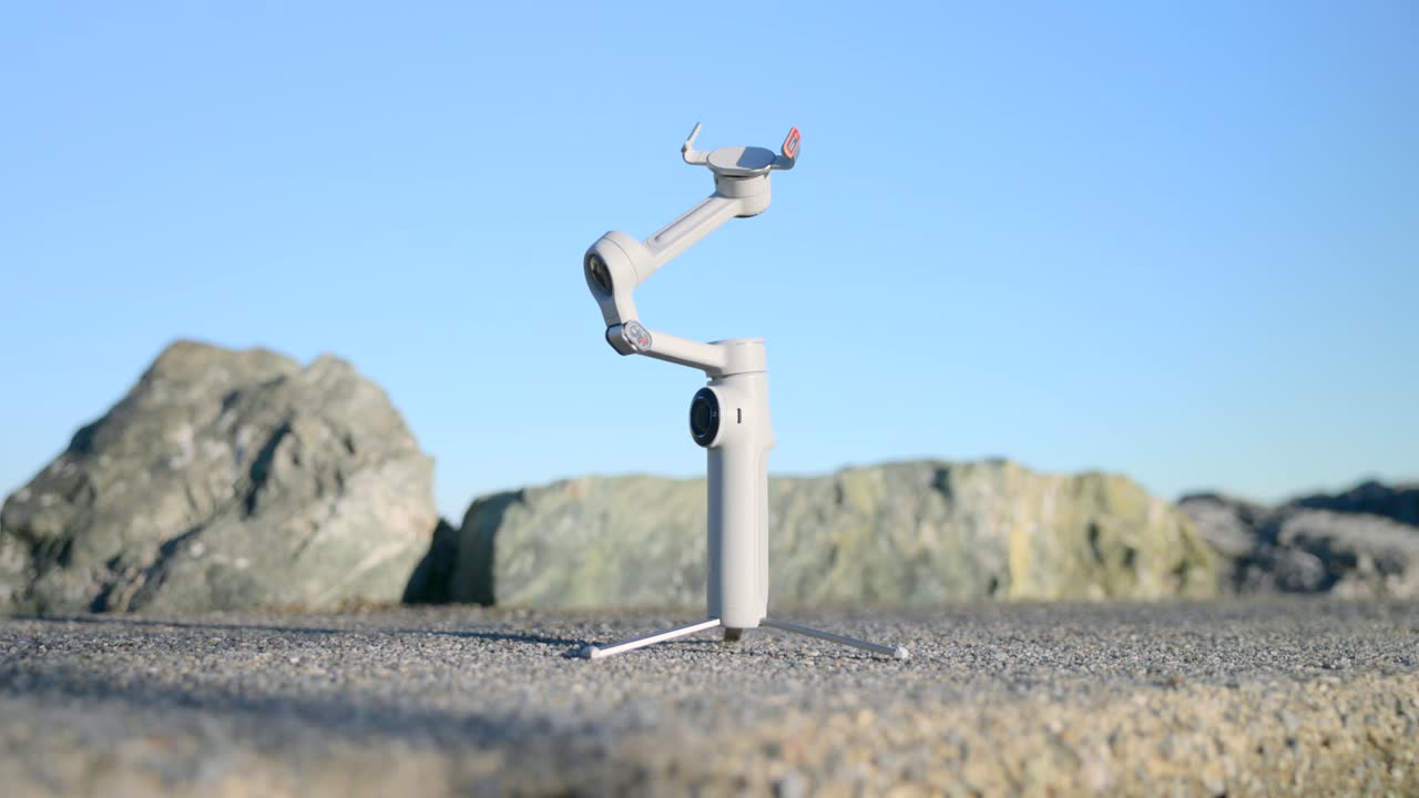 Smartphone Gimbal Stabilizer with Tripod Outdoors on a Sunny Day