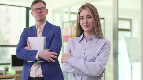 two business professionals standing in an office